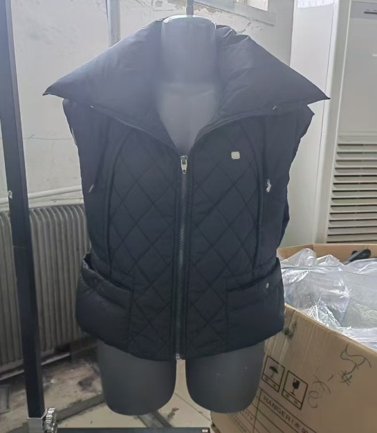 Black quilted high-collar vest